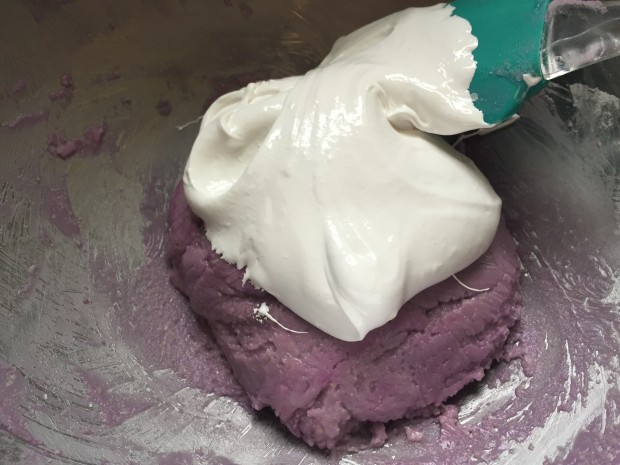 add 1/3 of the meringue to the almond paste